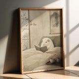 Product presentation view of White Guinea Pig Reading in Bed Poster.