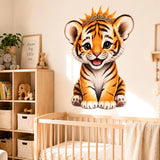 Cute baby tiger cub wall vinyl decal with big eyes and a golden crown, sitting and smiling on a white background.