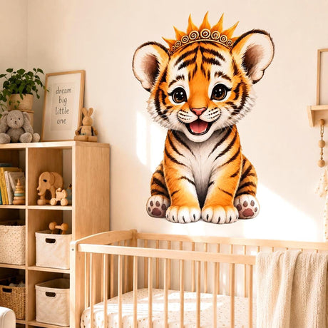 Cute baby tiger cub wall vinyl decal with big eyes and a golden crown, sitting and smiling on a white background.