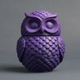 Detailed 3D printed owl-shaped memorial urn with removable lid in matte PLA displayed against a soft gray background.