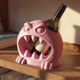 3D printed open-mouth monster wine bottle holder with sculpted teeth and inserted bottle