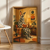Product view of Checkered Giant Rabbit Reading in Armchair Poster.