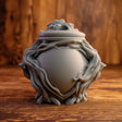 3D printed goblincore woodland memorial urn with sculpted twisting roots and organic forest details.