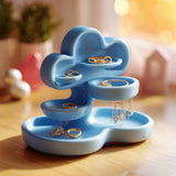 Light blue cloud-shaped jewelry organizer with layered trays and a round dish.