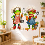 Two bright green cartoon frogs dressed as chefs, wearing oversized white hats and colorful aprons.