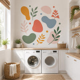 Abstract botanical wall decal set shown in a room setting.