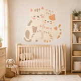 Cute cat family wall decal shown in a room setting.