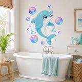 Cute dolphin wall decal shown in a room setting.