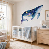 Celestial galaxy whale wall decal shown in a room setting.
