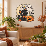 Halloween black cat in an orange bow tie wall sticker above a rattan sideboard in a bright living room.