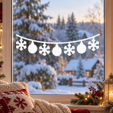 White Christmas window garland with three round baubles and four hanging snowflakes