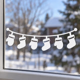 Six festive stockings suspended from a curved garland in a white vinyl window decal
