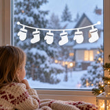 Minimalist Christmas garland design with six white stocking shapes for window decoration