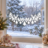 Holiday window decal showing reindeer silhouettes with hanging ornaments, stars and little trees