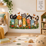 Cat wall sticker with five curious cats behind a painted wooden fence decorated with flowers and butterflies.