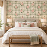Peel and stick floral wallpaper with pink rose clusters over a cream and sage green plaid ground.