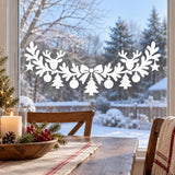White Christmas window garland with two reindeer heads, a central ribbon bow and evergreen branches