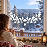 Festive white vinyl window garland with hanging stars, baubles and winter snowflake shapes