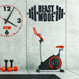 Надпись Beast Mode в спортзале с велотренажёром