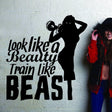 Motivational fitness wall sticker with the quote “Look like a beauty, train like a beast.”