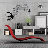 Wall sticker featuring musical notes and headphones with the text 'Music is Life' on a modern interior wall.