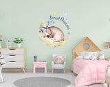 Nursery wall featuring a sweet dreams animal decal on a moon.