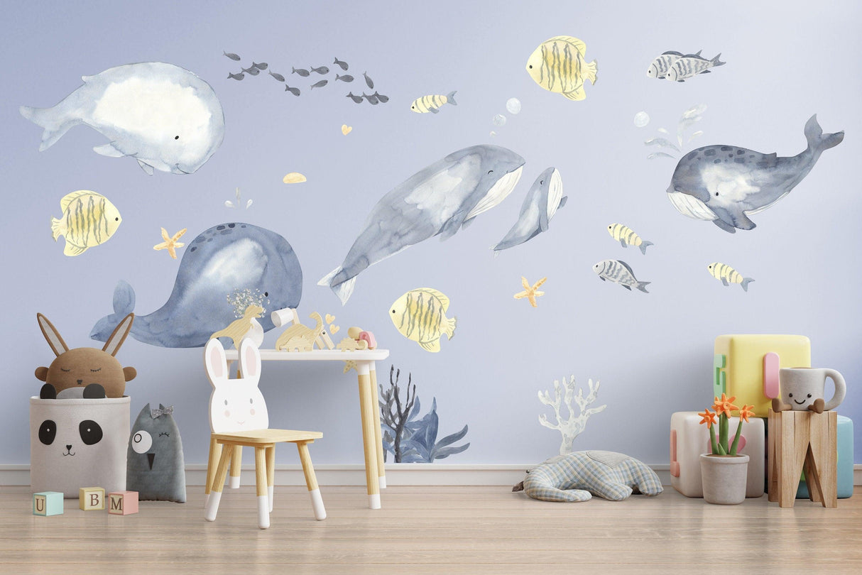 Undersea themed wall decals featuring playful whales and ocean creatures.
