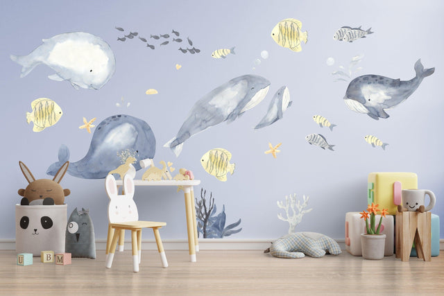 Undersea themed wall decals featuring playful whales and ocean creatures.