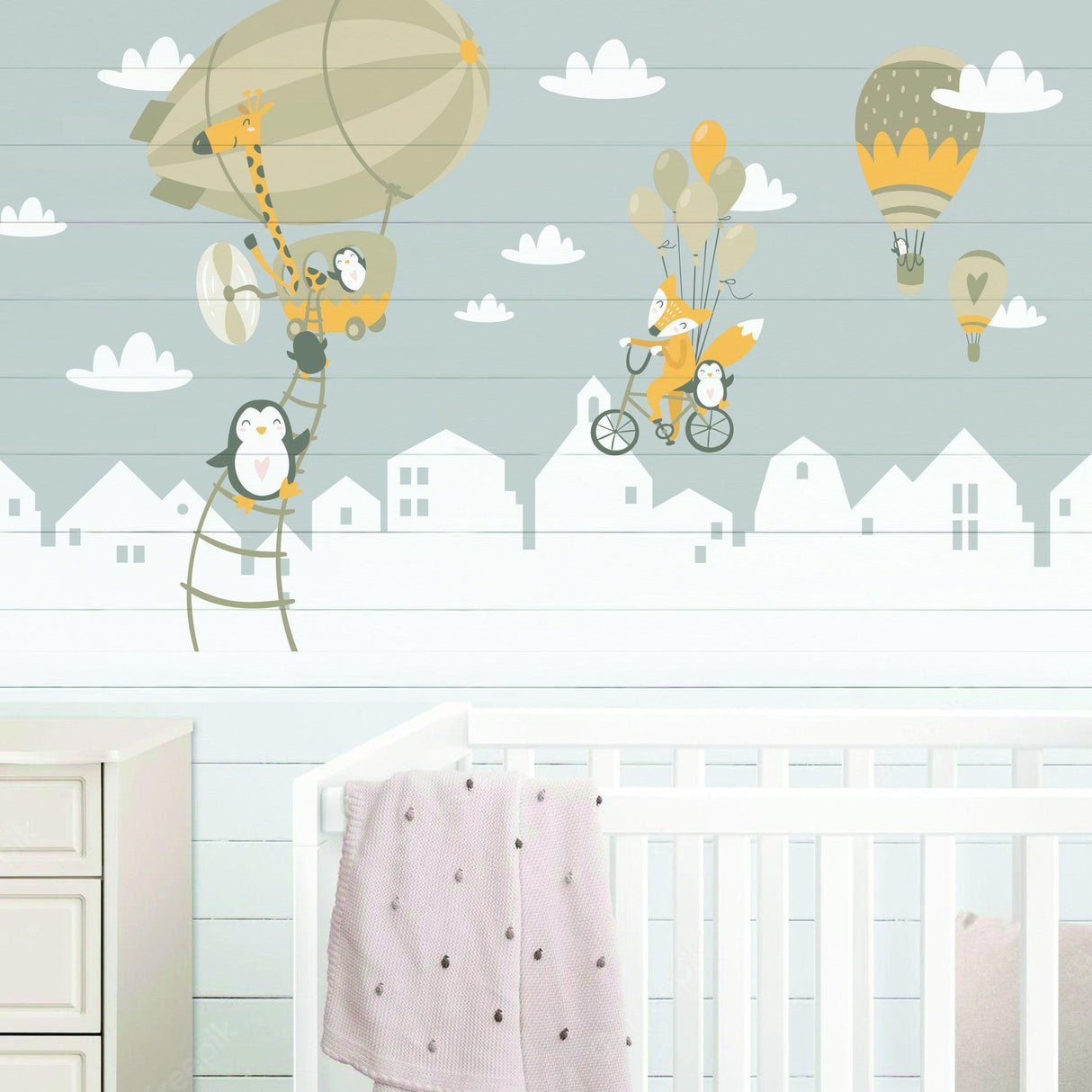 Adorable wall stickers featuring penguins and a fox with balloons.