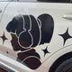Custom personalized vinyl sticker shown on a vehicle.