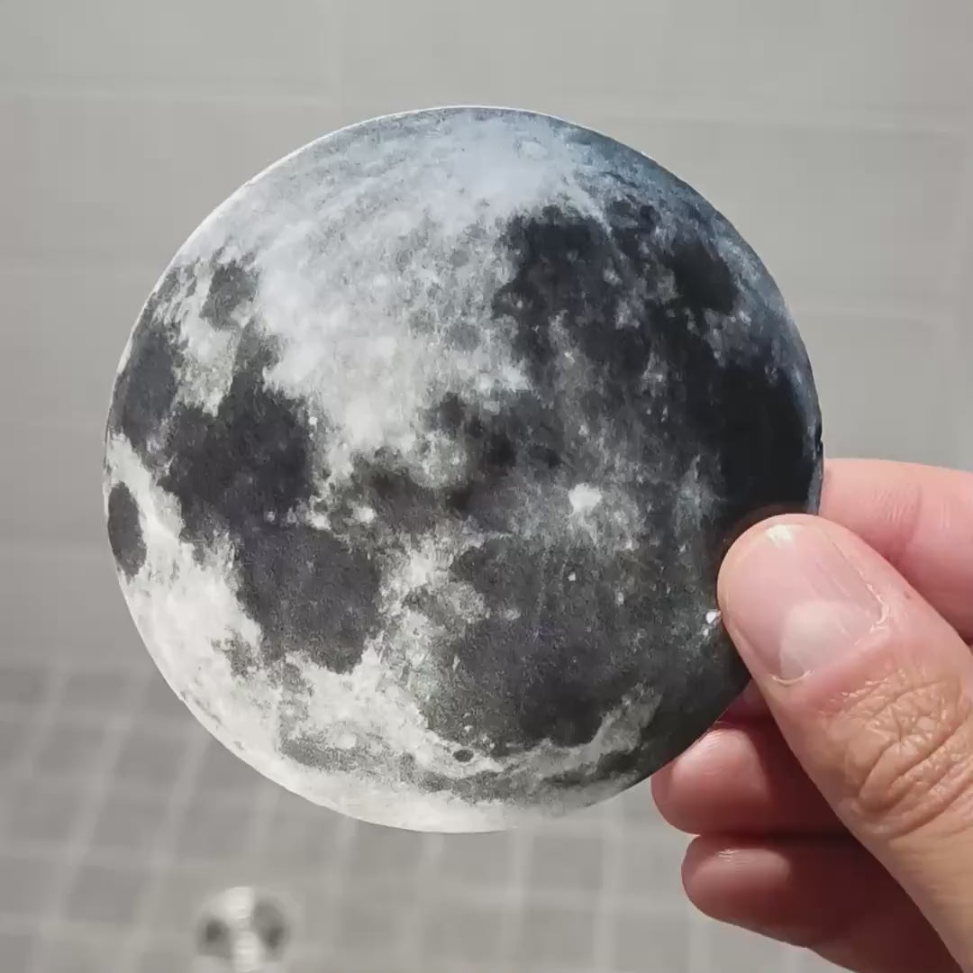 Glow-in-the-dark full moon ceiling decal shown in a product video.