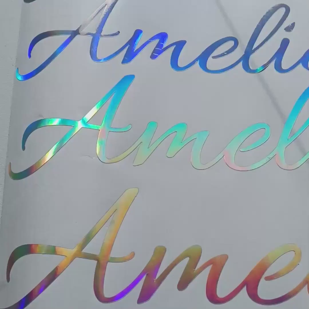 Personalized holographic name decals shown in a product video.