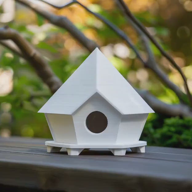 3D printed geometric birdhouse ornament shown in a product video.