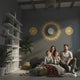 Golden sun mandala wall decal shown in a product video.