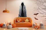 Tall abstract figure silhouette wall decal displayed above a sofa.