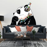 Panda in headphones street art wall decal above a sofa in a modern living room.