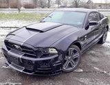 Sleek black car with racing stripes decals, showcasing a stylish upgrade for any vehicle.
