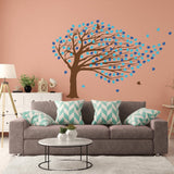 Fantasy tree wall sticker with colorful leaves in a modern living room setting.