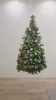 Decorated pine Christmas tree wall decal being removed in a product video.