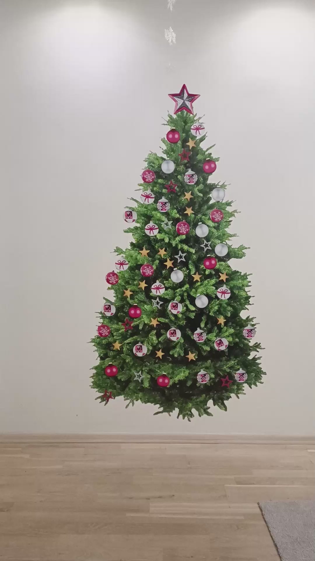 Decorated pine Christmas tree wall decal being removed in a product video.
