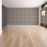 Interior of a modern room featuring a peel stick faux stone wall panel.
