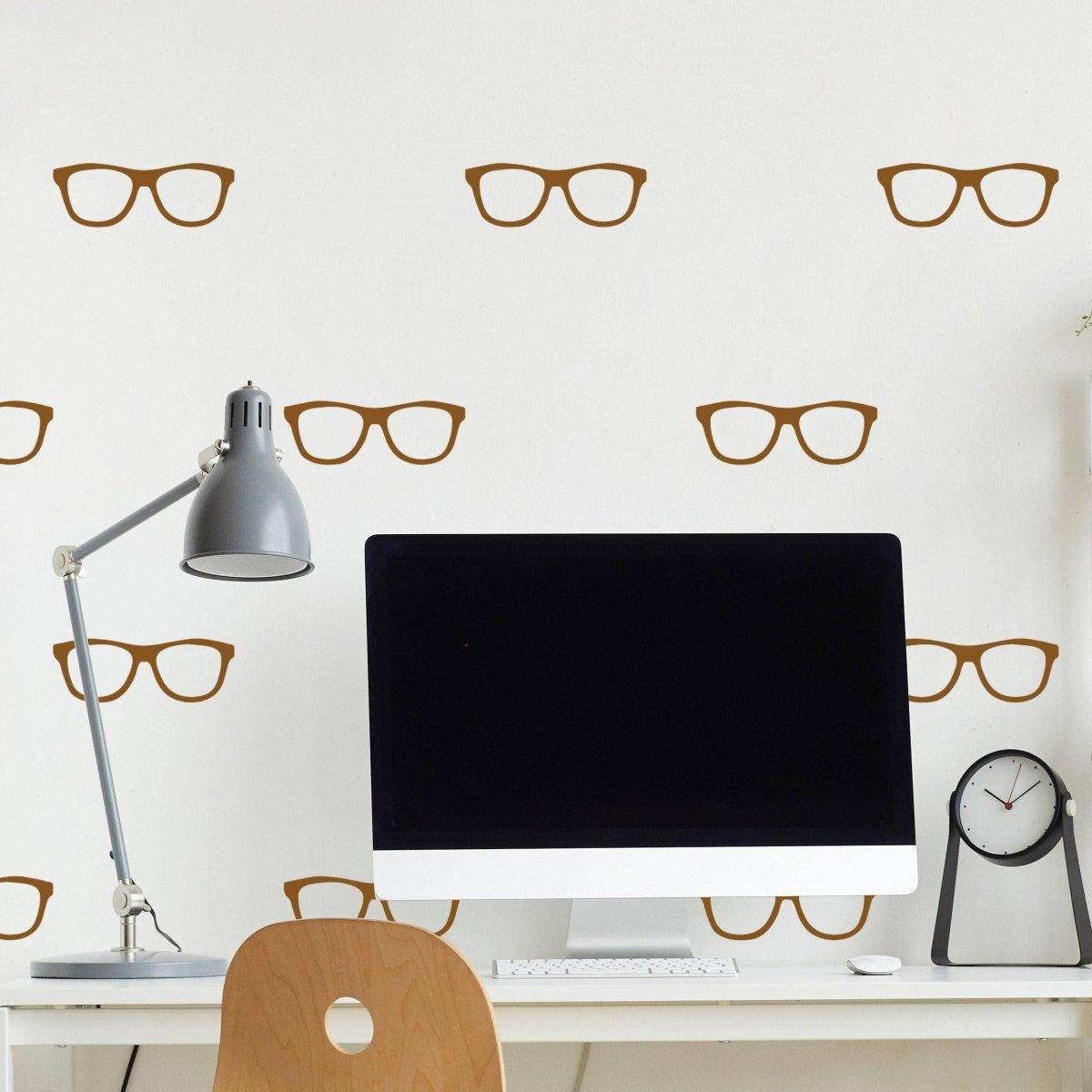 Stylish wall adorned with glasses decals, enhancing the workspace atmosphere.