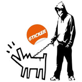 Banksy wall art decal featuring a hooded figure with a dog.