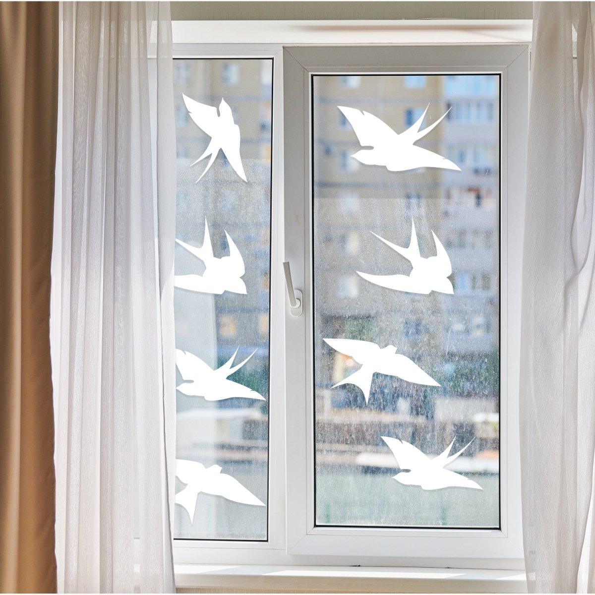 Frosted bird silhouette window decals to prevent bird strikes and enhance home aesthetics.