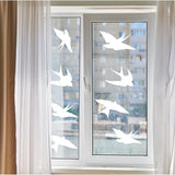 Frosted bird silhouette window decals to prevent bird strikes and enhance home aesthetics.