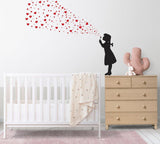 Graffiti art wall decal of a girl blowing red hearts, enhancing a child's nursery decor.