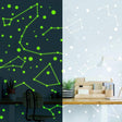 Glow in the dark zodiac star wall decals on a stylish home office wall, illuminating constellations and stars.