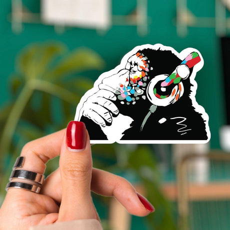 Contemplative monkey sticker with colorful design.