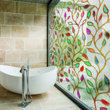 Elegant etched leaf design privacy glass window film in modern bathroom, allowing light while ensuring privacy.