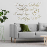 Love Forever Wall Sticker on a stylish living room wall above a modern couch with greenery.